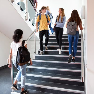 01-high-school-students-walking-on-stairs-between-SQE892G.jpg